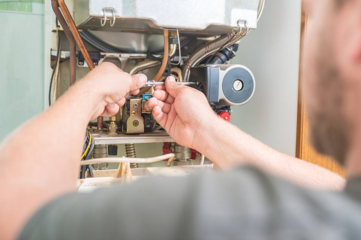 Technician doing air conditioner tune-up